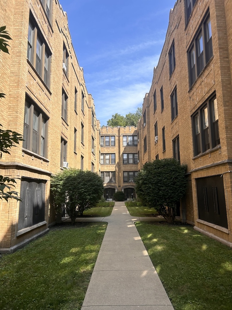 a view of a building with a yard