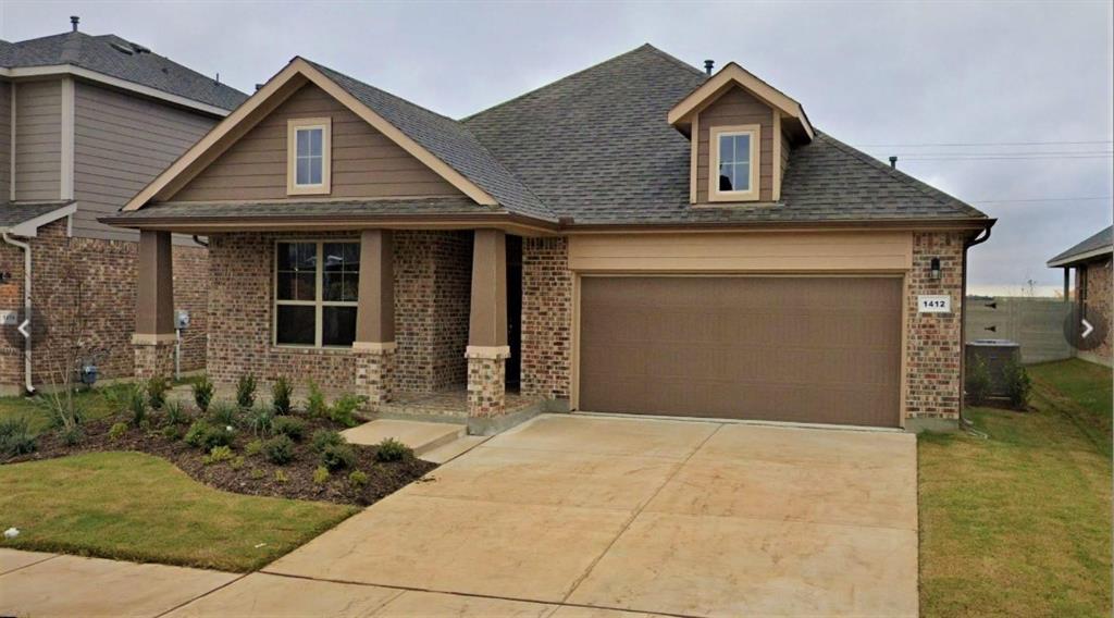 a front view of a house with a garage