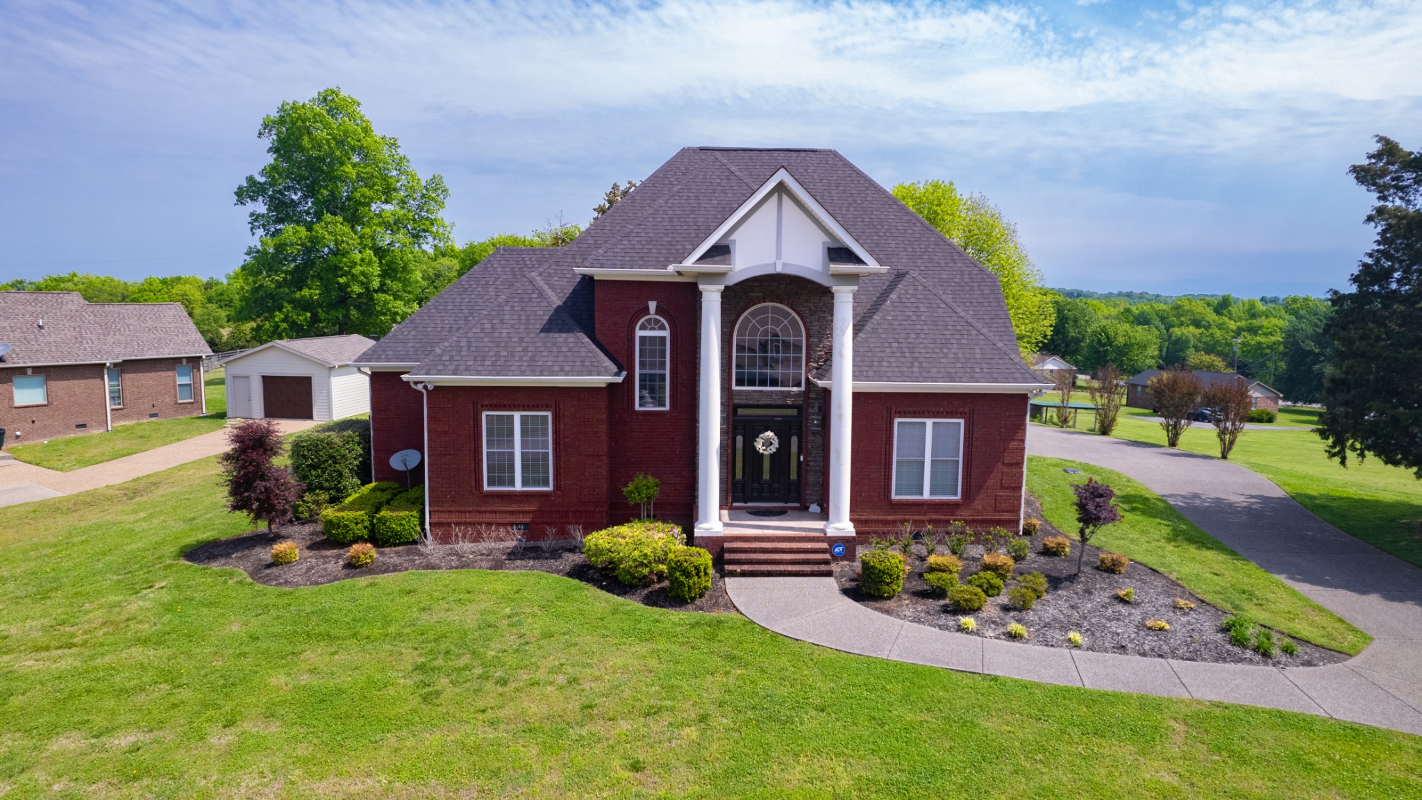 a front view of a house with a yard