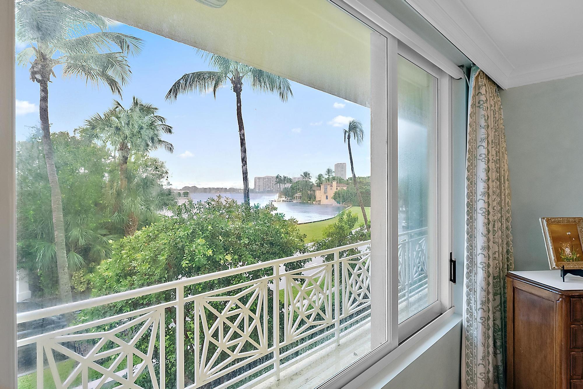 a view of a balcony with chairs