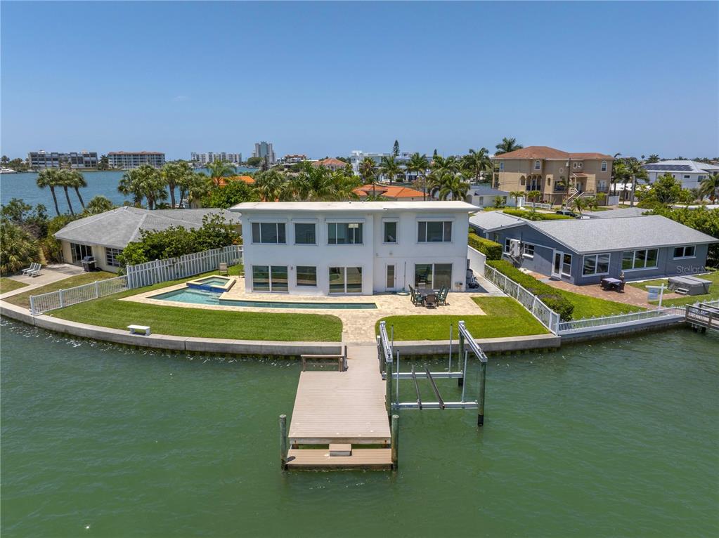 an aerial view of a house with a big yard