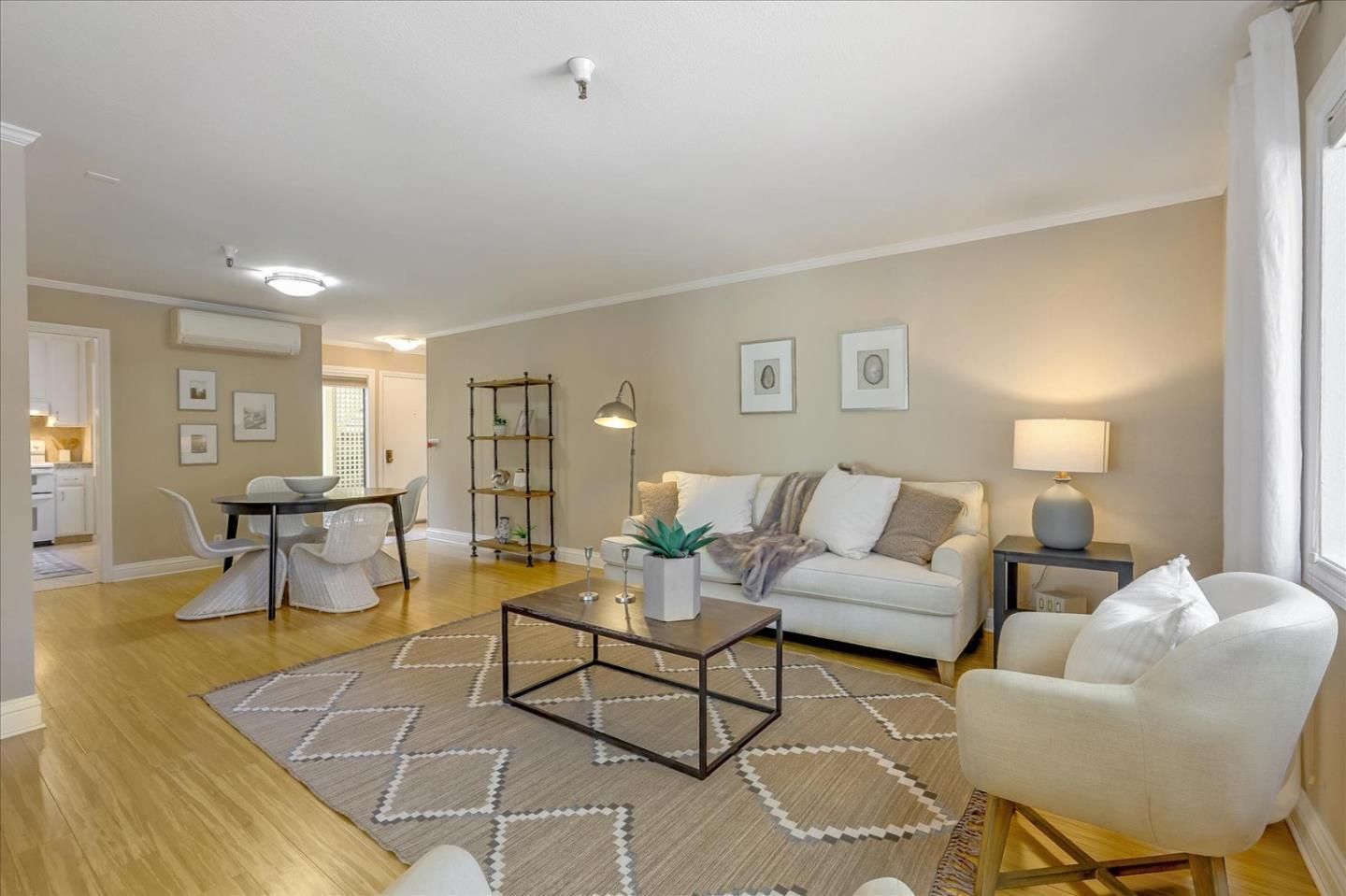 a living room with furniture and a table