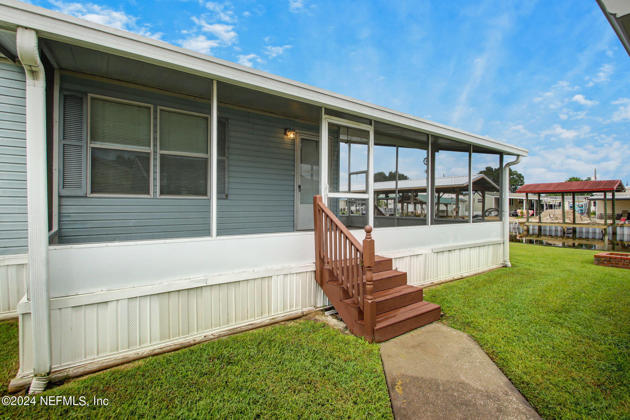 a view of house with outdoor space and seating area