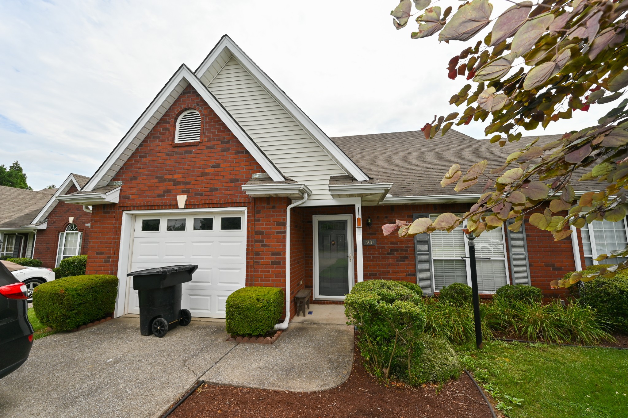 a front view of a house with garden