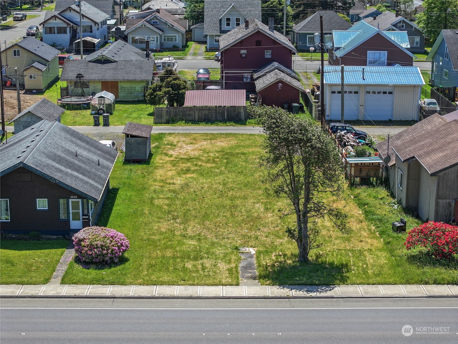 a view of a house with a garden and pathway