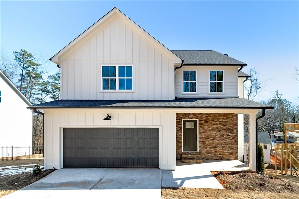 a front view of a house with a garage