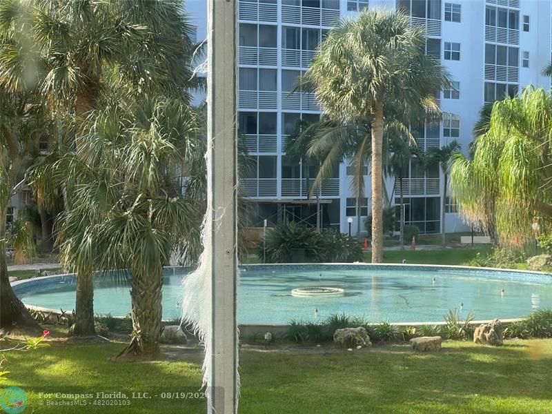 a view of outdoor space with garden and trees