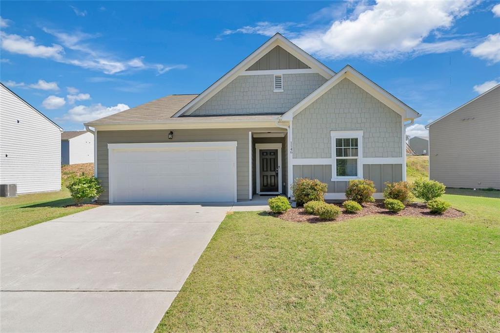 a front view of a house with a yard