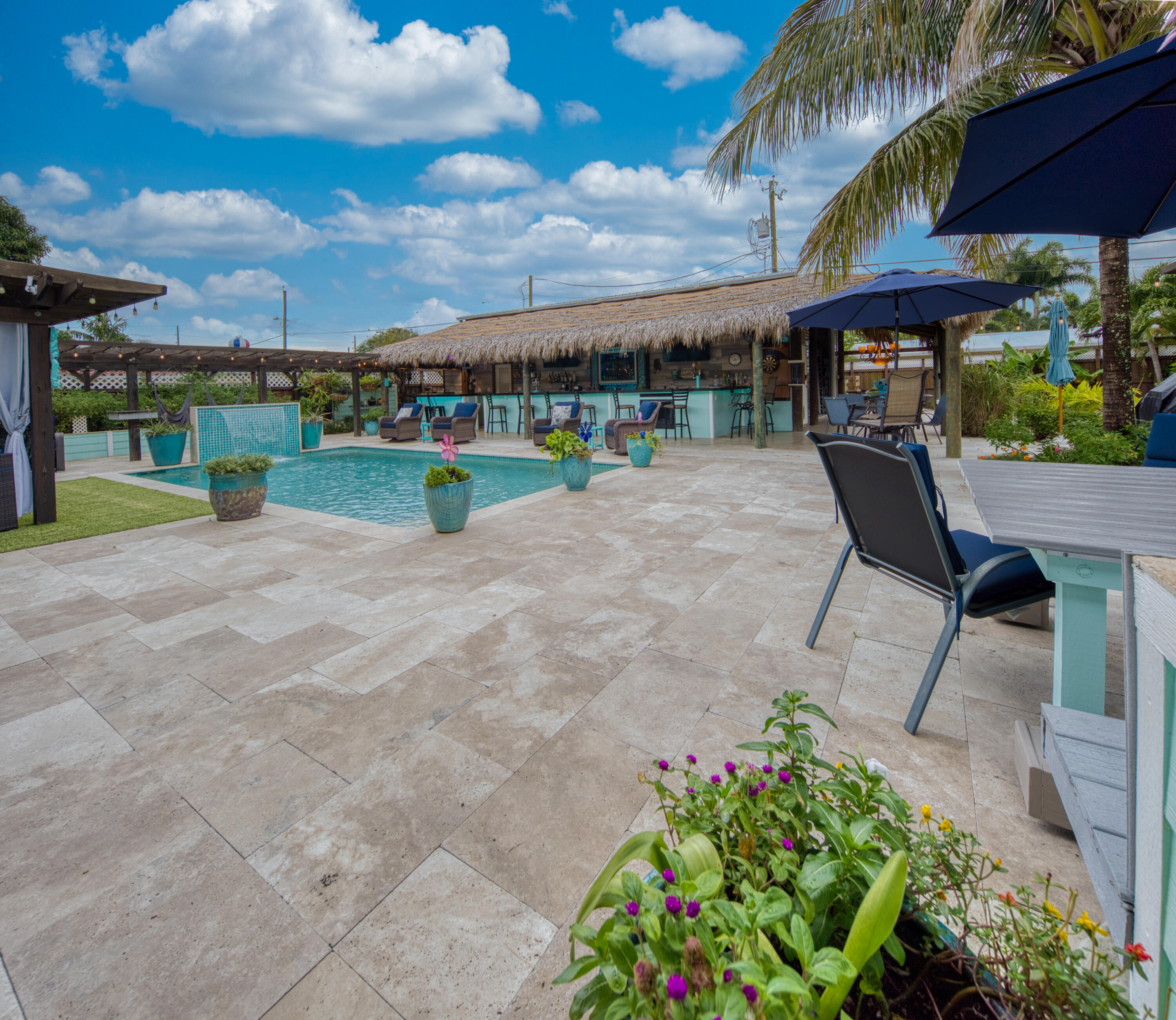 a view of a backyard with sitting area