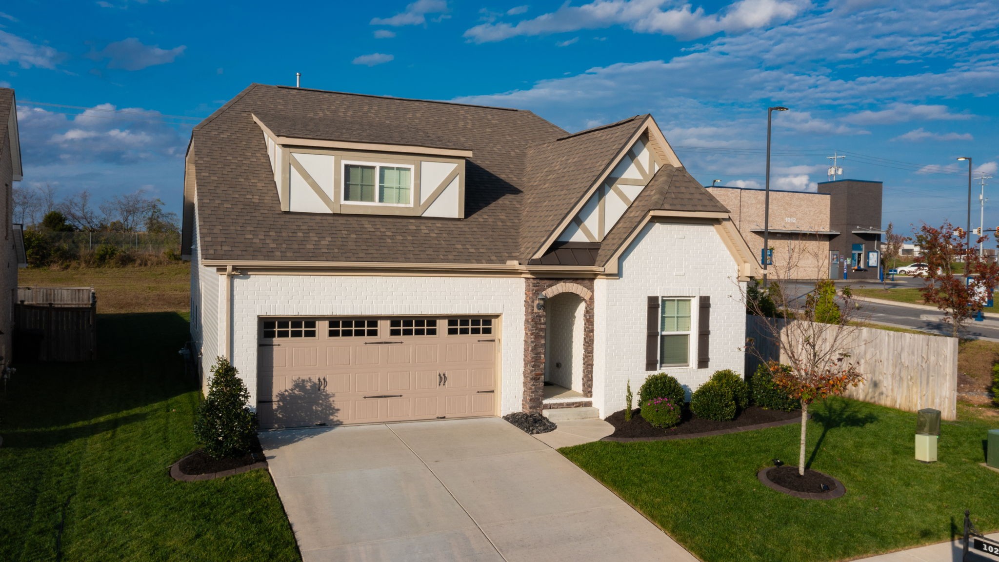 a front view of a house with garden