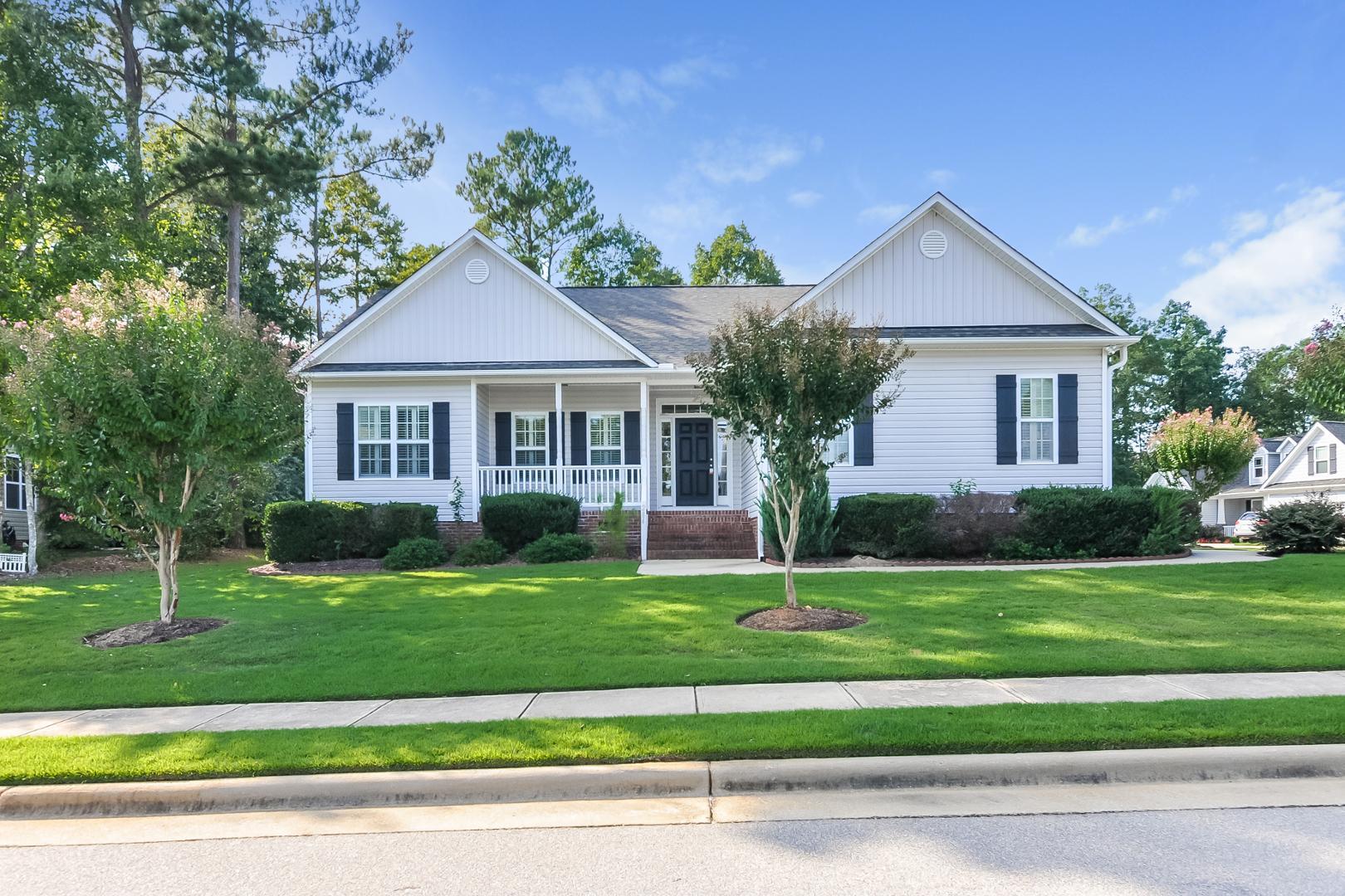 a front view of a house with a yard