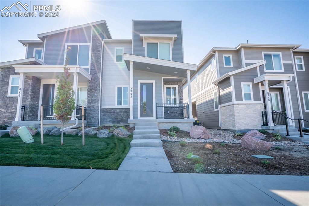 a front view of a house with a yard