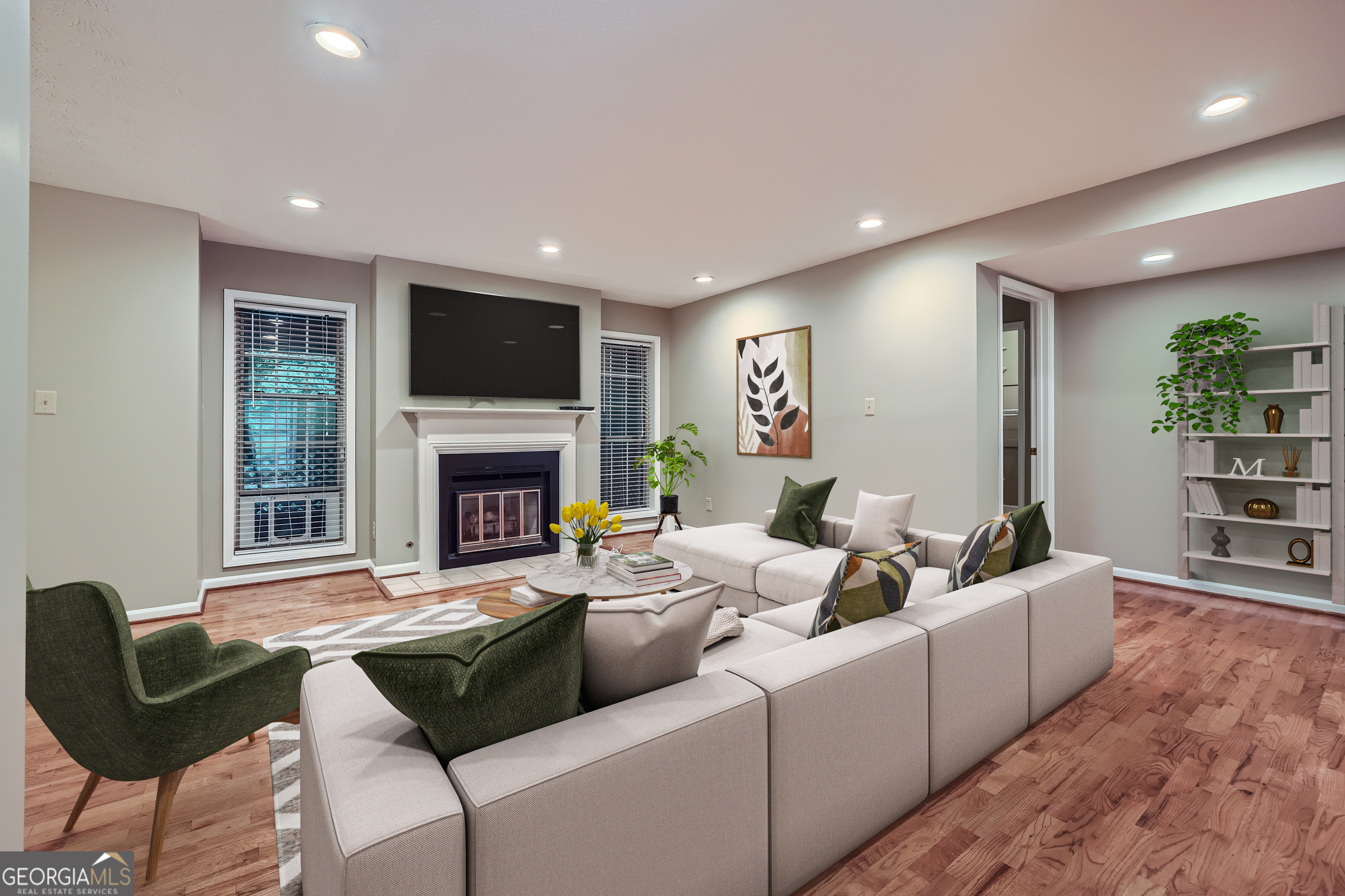 a living room with furniture and a fireplace