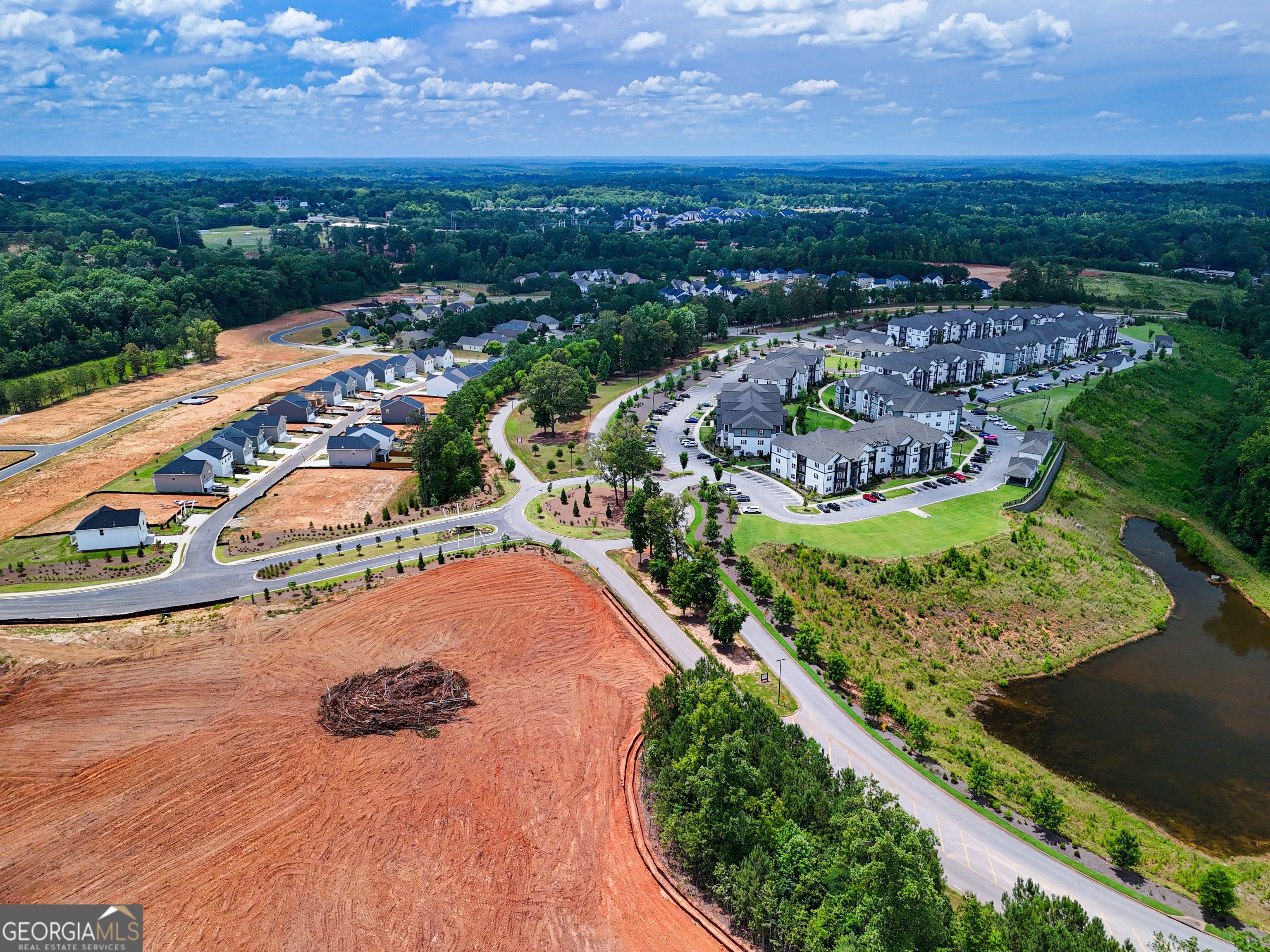 an aerial view of residential houses with outdoor space