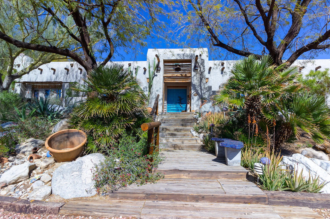 a view of house with outdoor space and sitting area