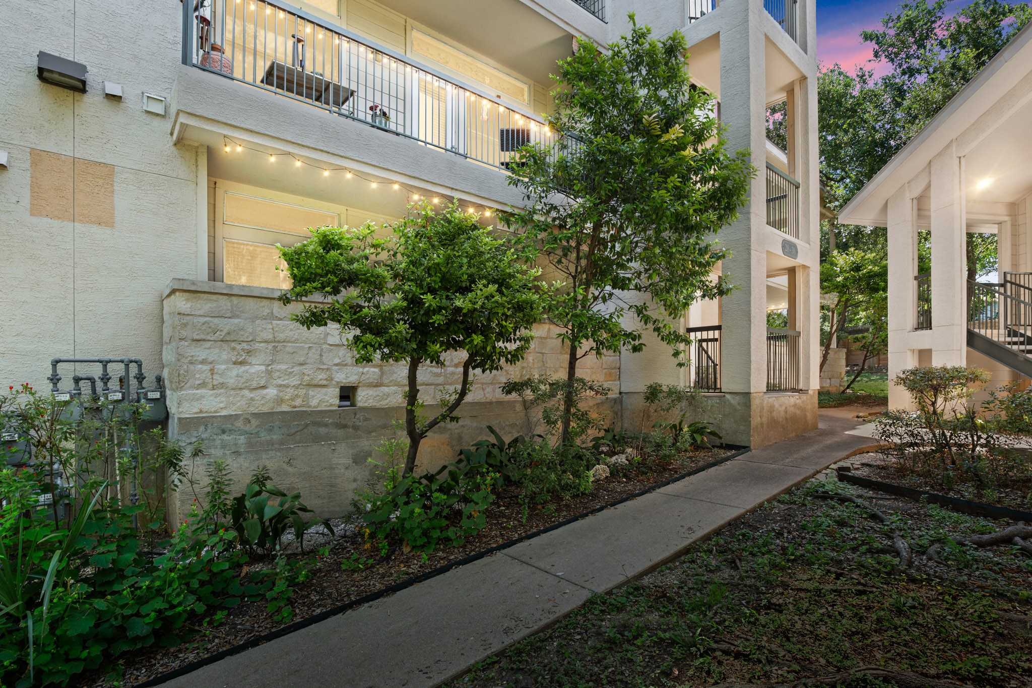 a view of a pathway of house and a yard