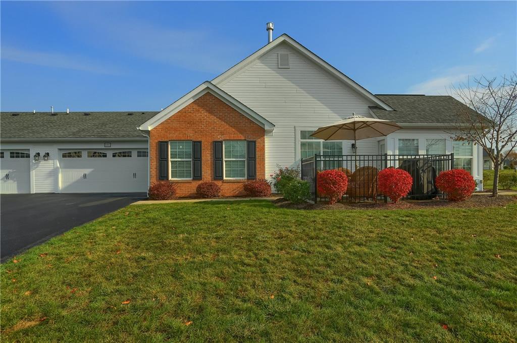 a view of front of house with a yard