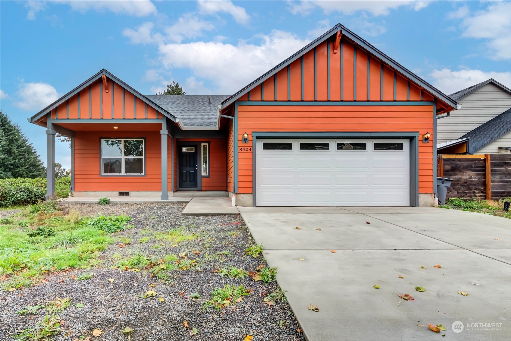 a front view of a house with garage