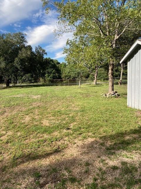 a view of a yard with a tree