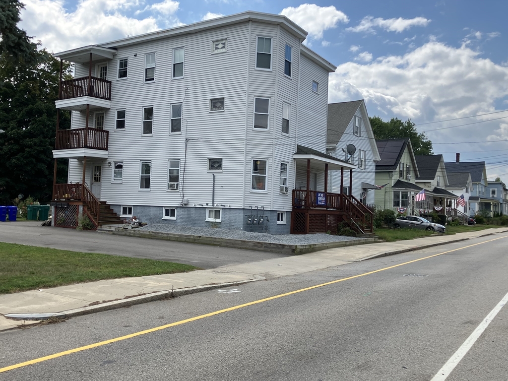 a front view of a building with a road