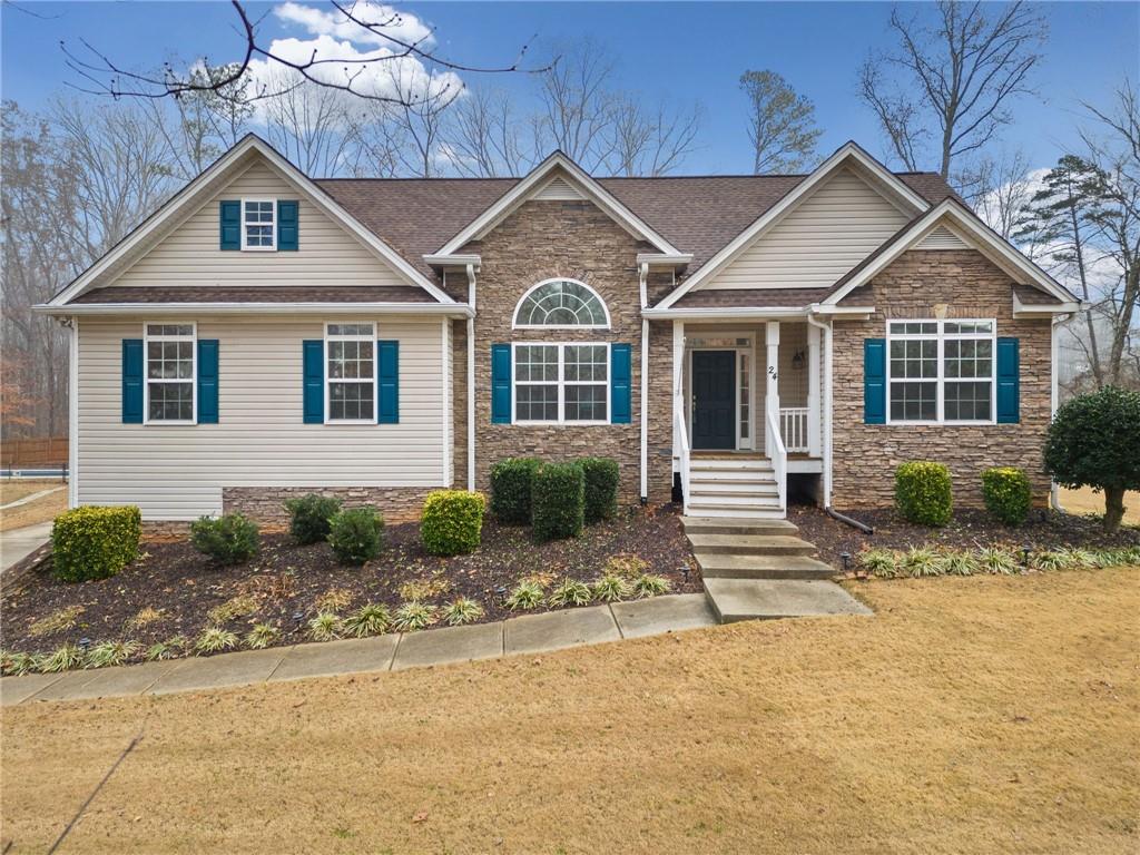 a front view of a house with a yard