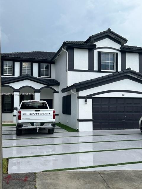 a view of a car parked in front of a house