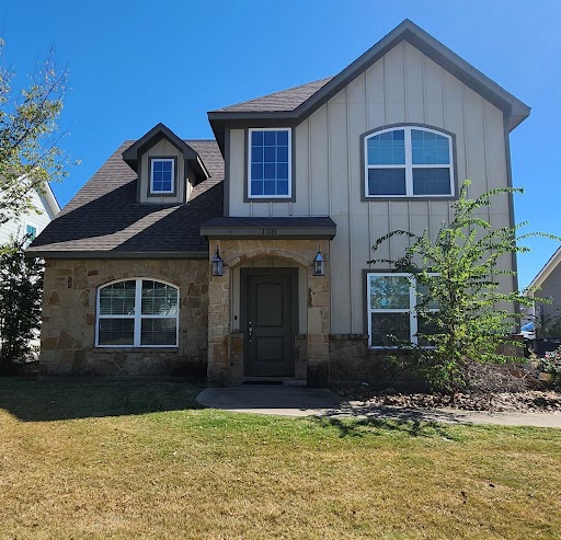 a front view of a house with a yard