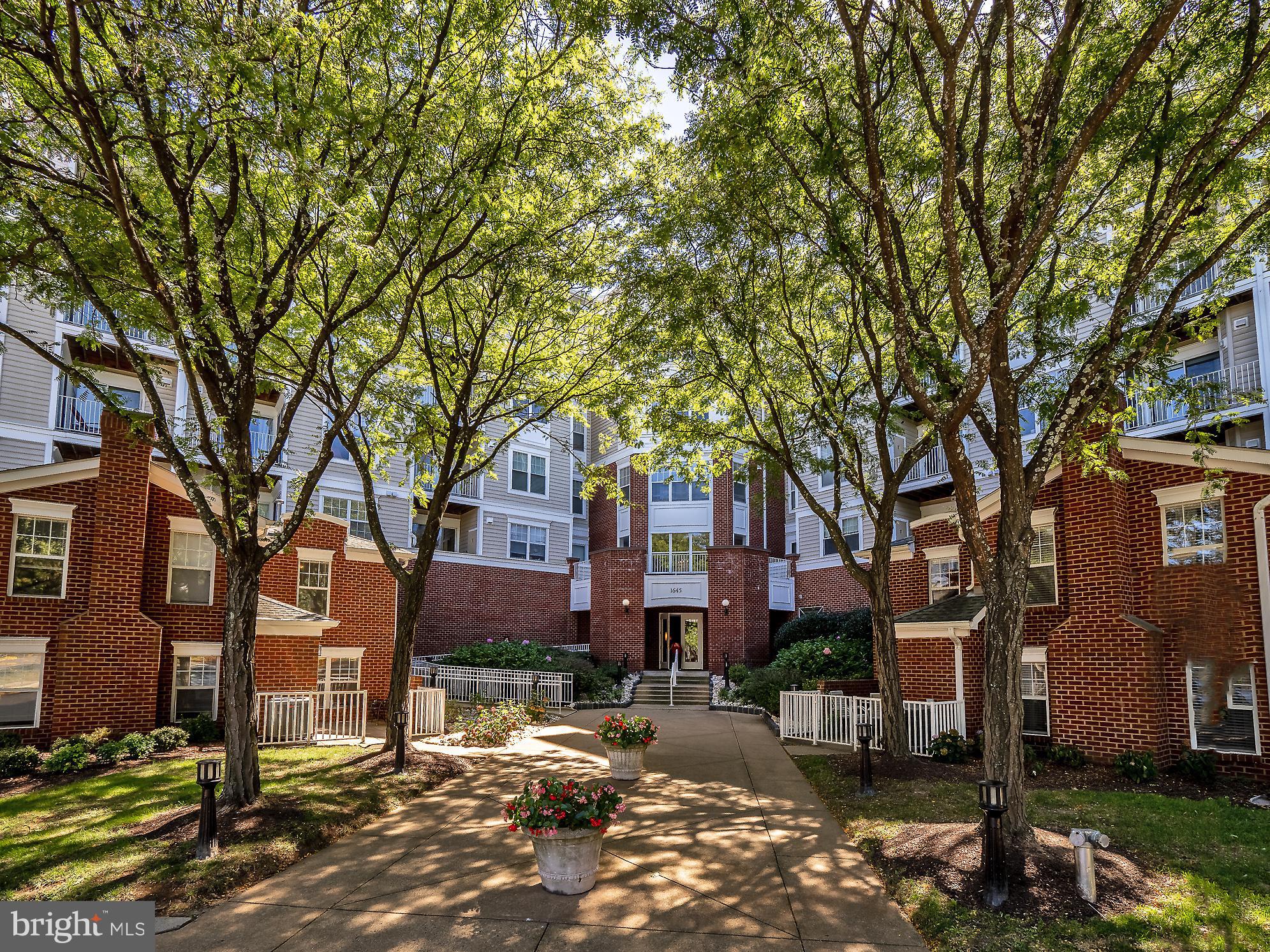 a view of a building with a large tree