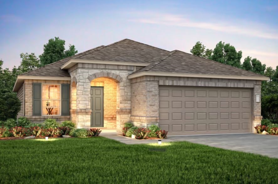 a front view of a house with a yard and garage