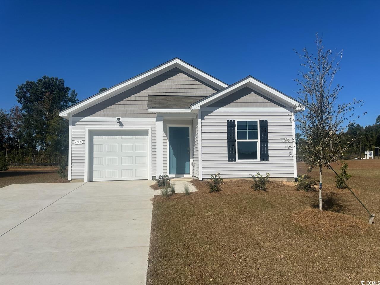 View of front facade featuring a garage