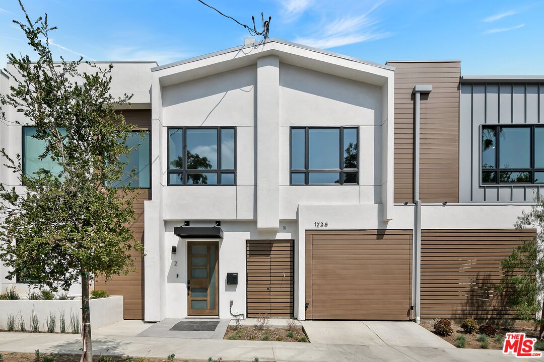 a front view of a house with glass windows