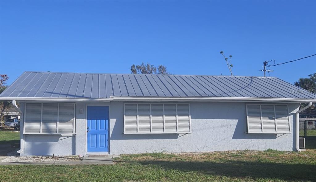 front view of a house with a yard