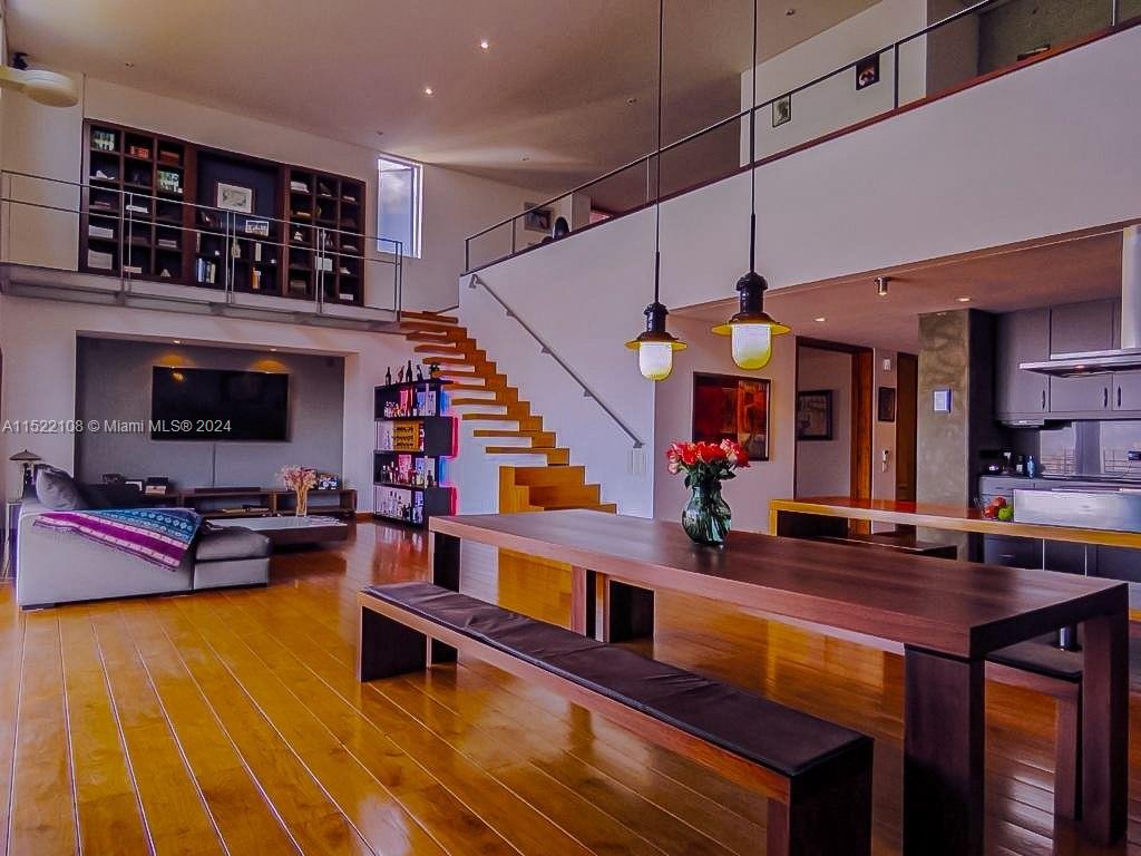 a living room with fireplace furniture and a wooden floor