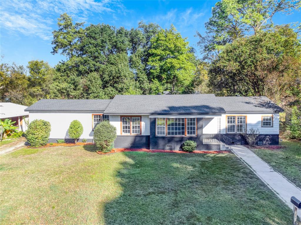 front view of a house with a big yard