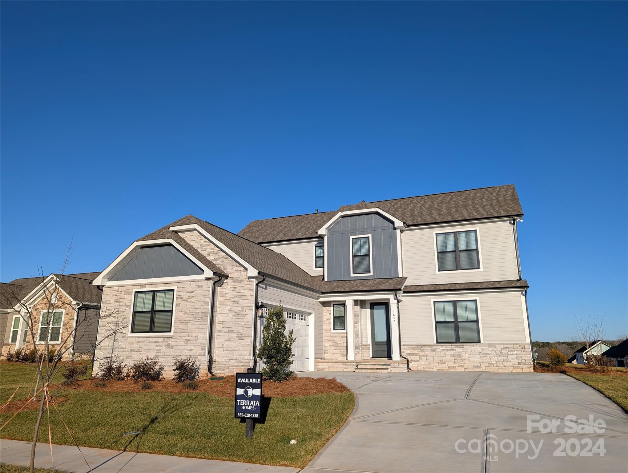 a front view of a house with yard