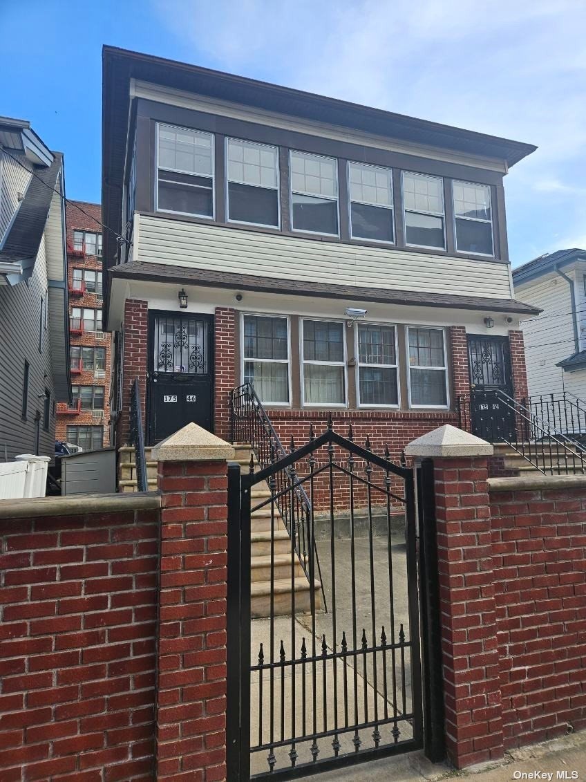 a front view of a house with glass windows