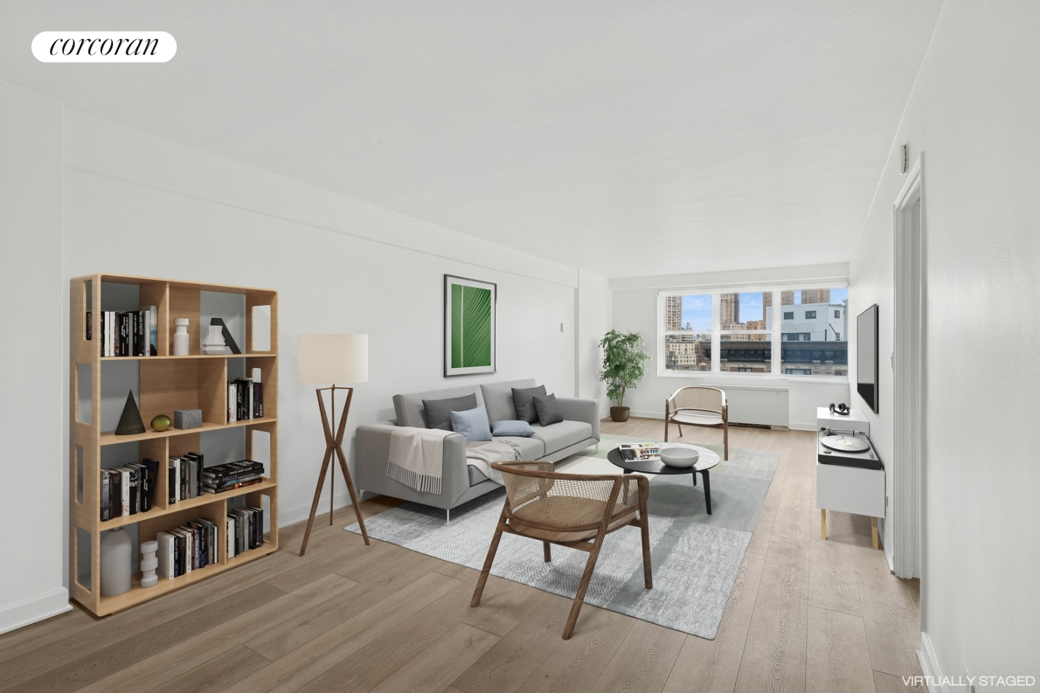 a living room with furniture and a book shelf