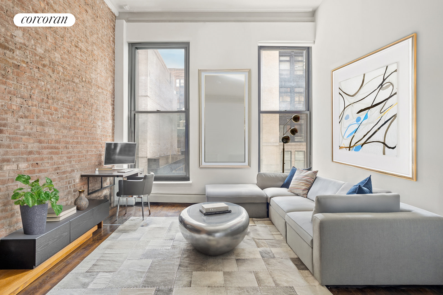 a living room with furniture and a potted plant