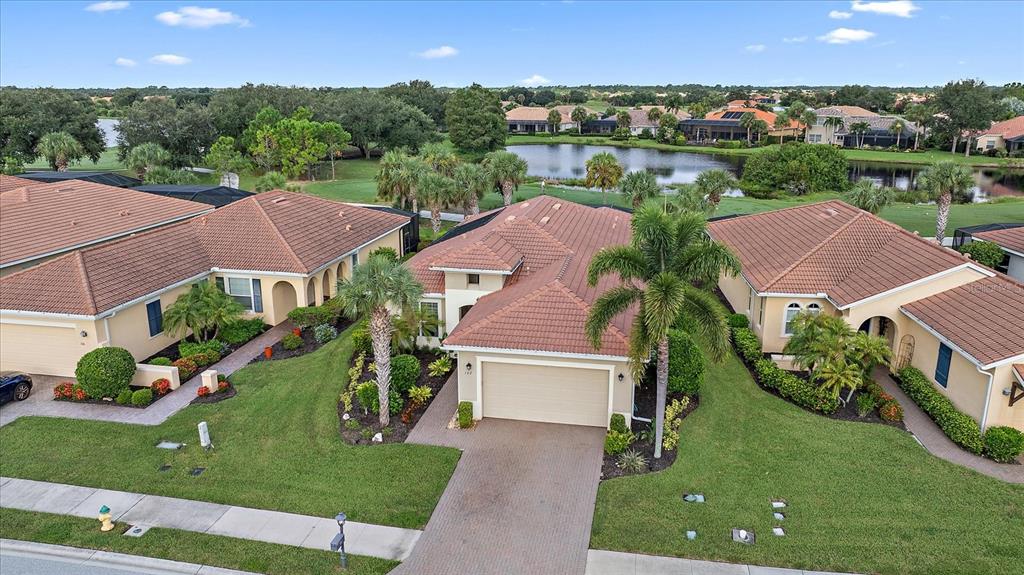 an aerial view of multiple houses with yard