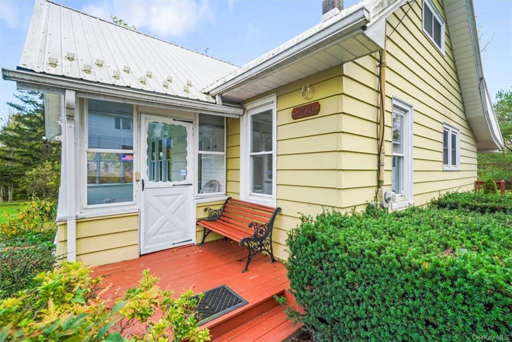 an outdoor view of house with outdoor seating