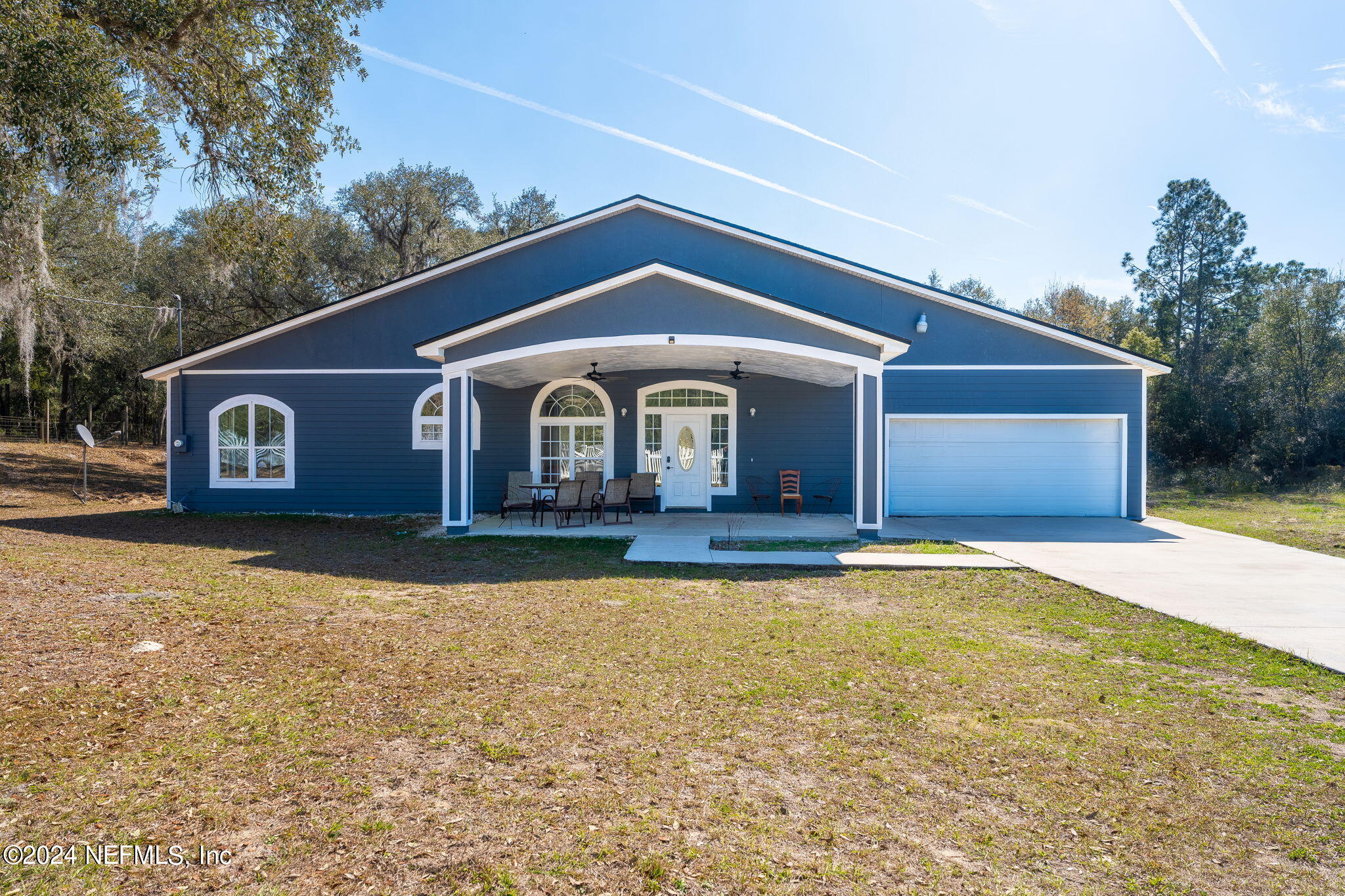 a front view of a house with yard