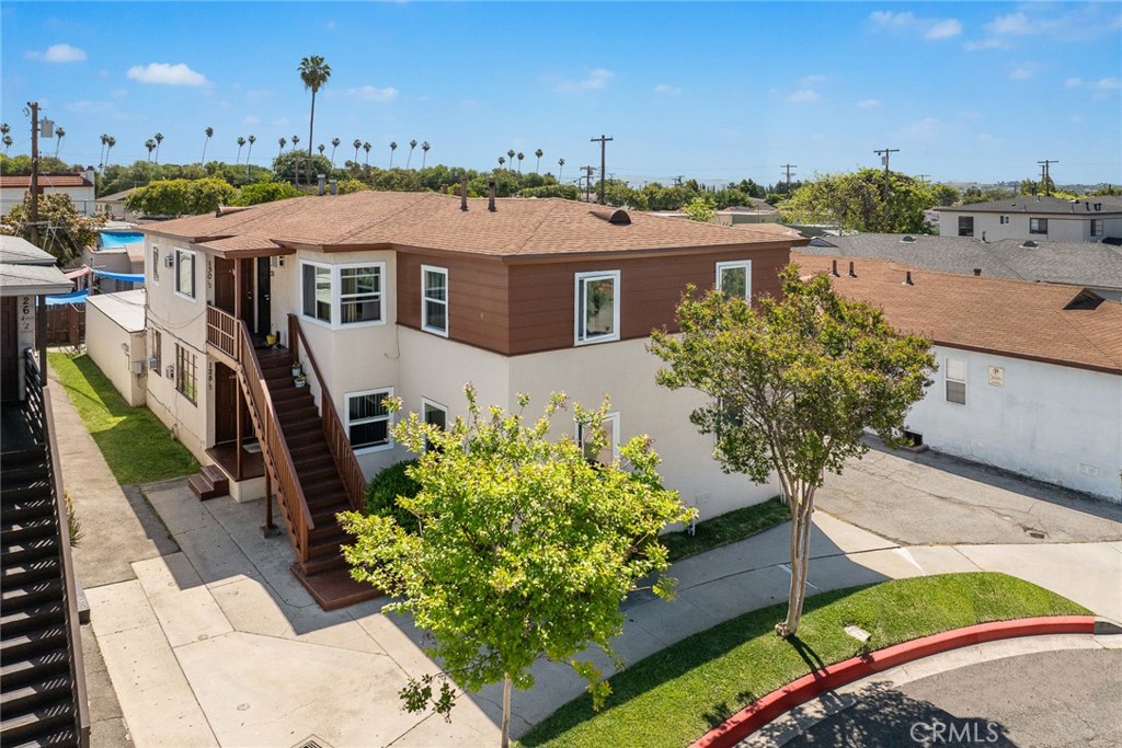 a aerial view of a house with a yard