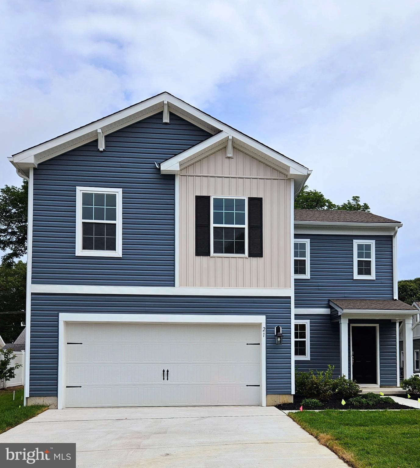 a front view of a house with garage