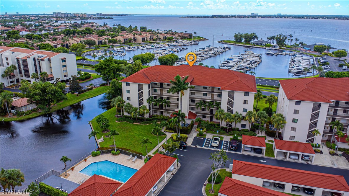 an aerial view of multiple houses with yard