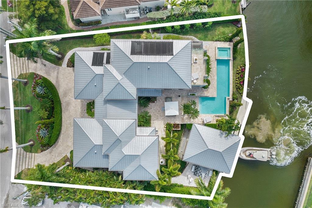 an aerial view of a house with outdoor space