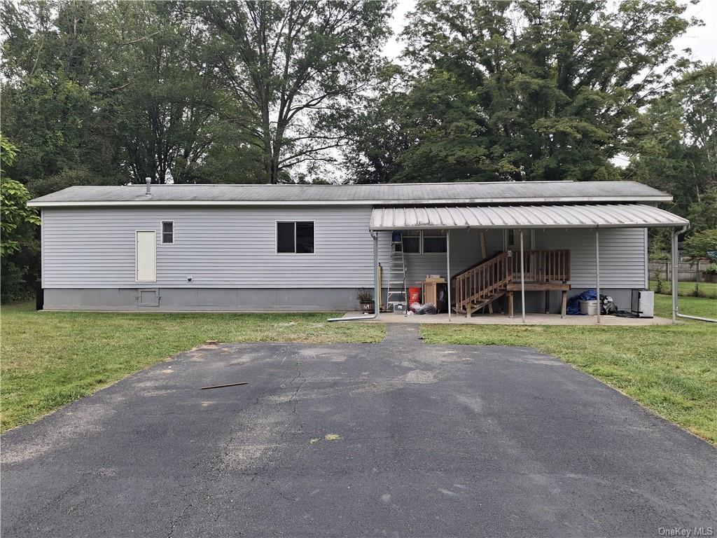 a view of outdoor space yard and front view of house