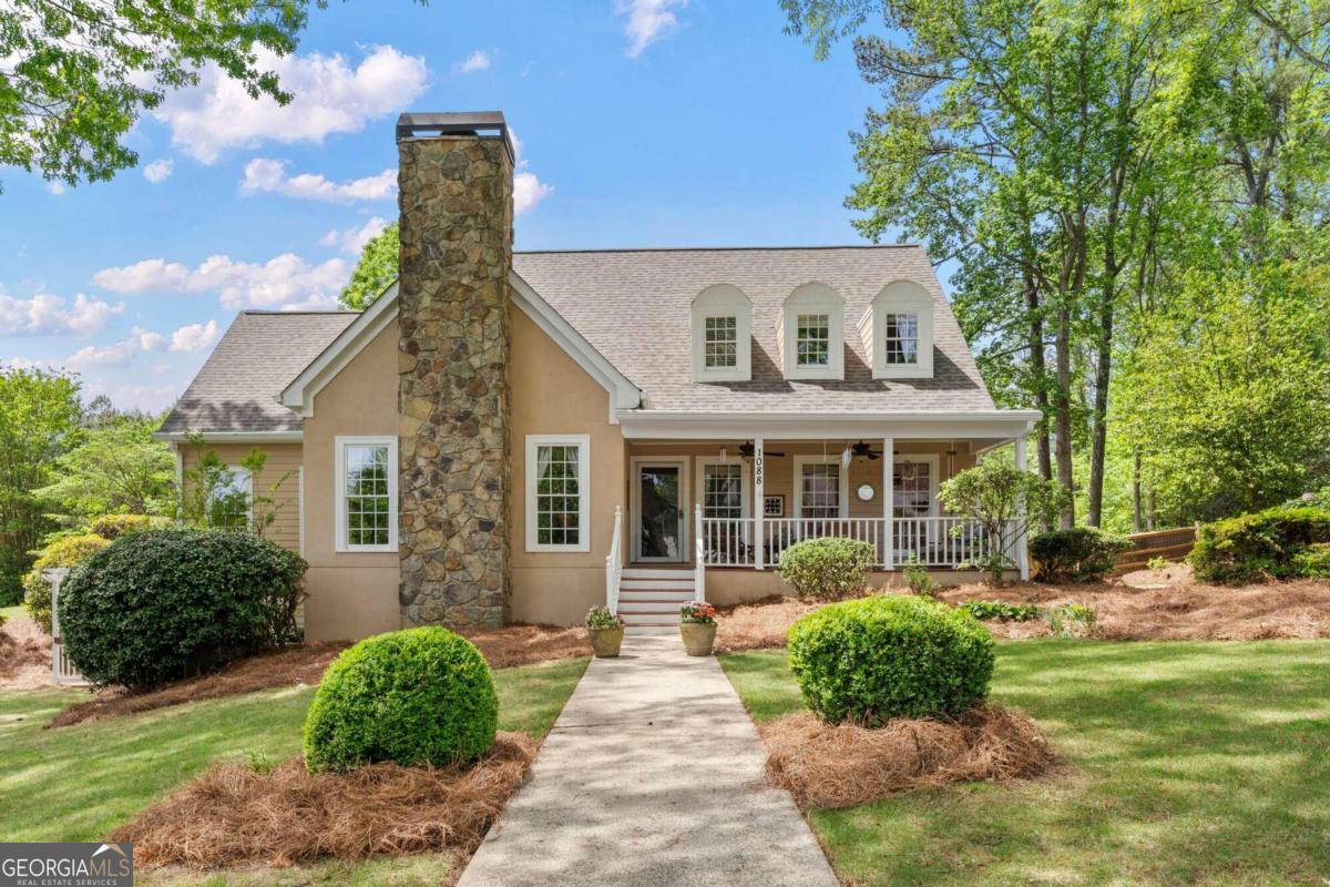 a front view of a house with garden