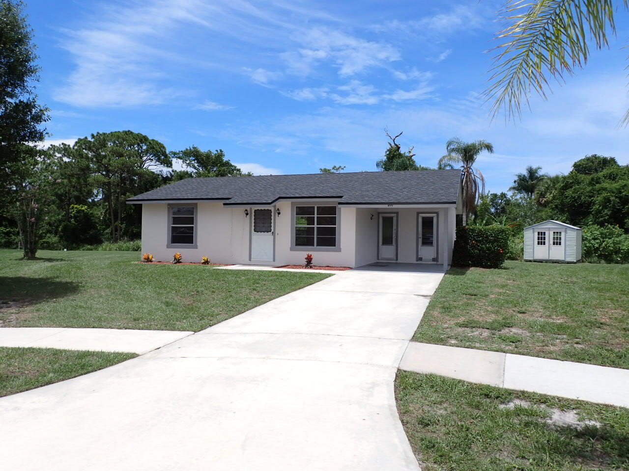 front view of a house with a yard