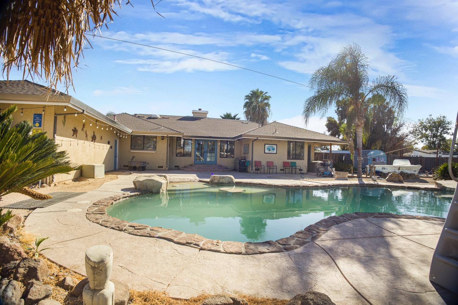 a view of a house with swimming pool