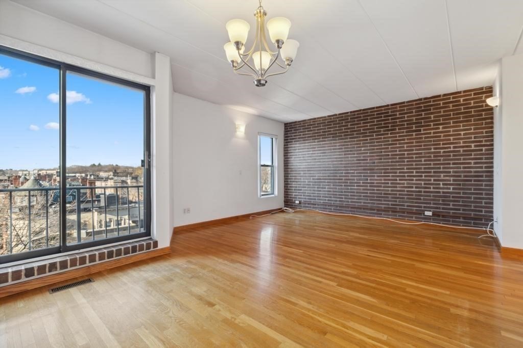 a view of a livingroom with wooden floor